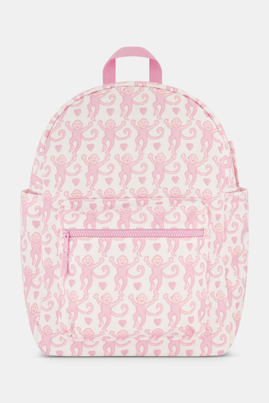 A pink backpack with a monkey pattern and multiple compartments. view 1