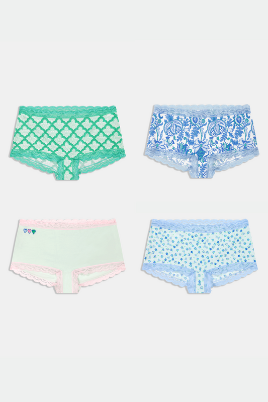 A four-pack of assorted women's boyshort underwear in green, blue, and white patterns. view 1