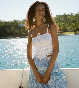 Roller Rabbit women in top and skirt on a boat