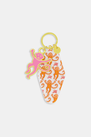 Rectangular Assorted Mystery Box keychain package with a repeating purple heart pattern and text reading Roller Rabbit Mystery Box surrounded by a border of dots.
