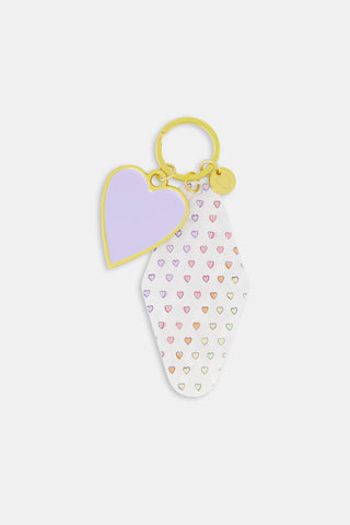 Rectangular Assorted Mystery Box keychain package with a repeating purple heart pattern and text reading Roller Rabbit Mystery Box surrounded by a border of dots.