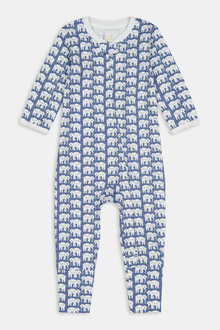 A man stands barefoot in Roller Rabbit's Mens Hathi Spencer Pajamas, a blue and white long-sleeve set with a small pattern and buttoned collar, made from 100 Pima Cotton, against a plain white background.