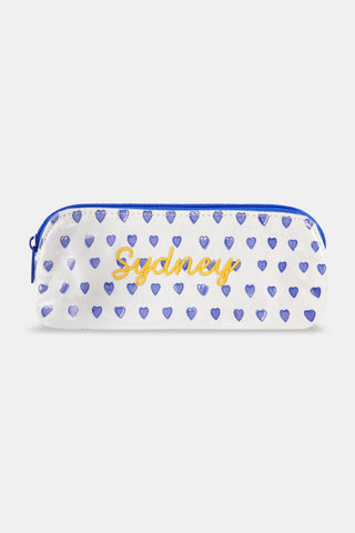 The Roller Rabbit Hearts Makeup Bag is a white water-resistant canvas pouch with a blue zipper and an all-over blue heart print.