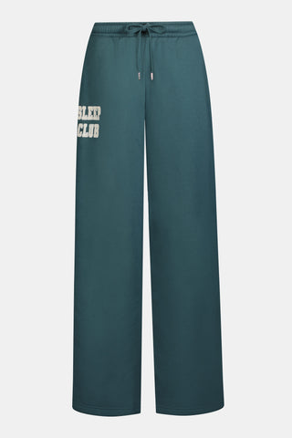 Deep teal wide-leg Sleep Club Mimi Sweatpants in Dream Fleece with an elastic drawstring waist and SLEEP CLUB printed on the right hip.