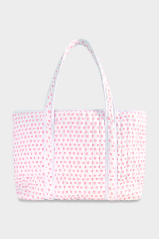 The Roller Rabbit Hearts Terry Beach Tote is a large quilted bag with two handles, featuring a white background and pink heart pattern—ideal for the beach or carrying your daily essentials.