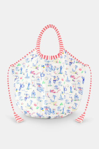 The Monkey On The Vineyard Bondi Bag by Roller Rabbit is a cotton canvas tote with red-and-white striped handles and trim, decorated with blue, green, and pink nautical and animal doodles—including lighthouses, crabs, and birds—on a white background.
