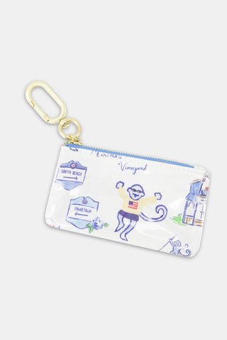 Small zippered pouch with pastel illustrations, featuring a monkey wearing a sweater, a house, signposts labeled South Beach and Edgartown, and a handy gold keyring clip attached to the zipper.