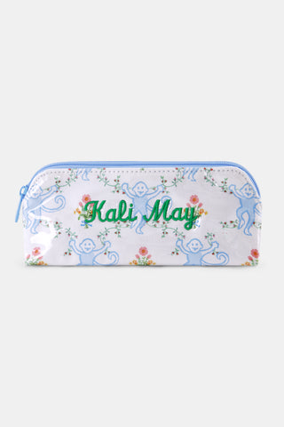 The Roller Rabbit Floral Monkey Trellis Makeup Bag is a limited edition white pouch with a light blue zipper, decorated with smiling blue monkeys and colorful flowers.