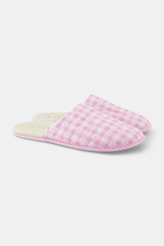 A pair of Roller Rabbit Gingham Hearts Quilted Slippers in pink and white, featuring closed toes and open heels, is displayed on a white background.