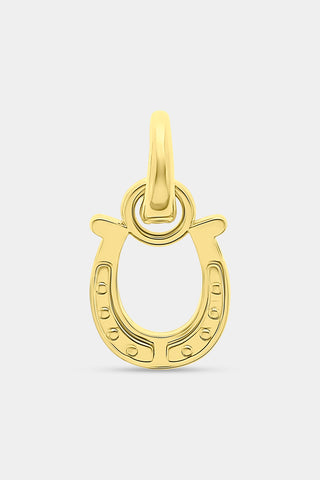 The Roller Rabbit Horseshoe Charm is a gold, horseshoe-shaped pendant designed as a luck charm, featuring a small loop at the top for attaching to a chain and set against a plain white background.