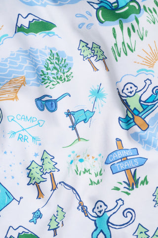 The Mens Camp RR Simon Pant by Roller Rabbit features playful outdoor camp illustrations—canoes, cabins, trees, tents, and monkeys—on soft Pima cotton. Inspired design in blue, green, orange, and white adds a whimsical touch.