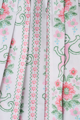 Sleeveless Monkey Block Stripe Ribbon Charlotte Nap Dress by Roller Rabbit, featuring shoulder tie straps, a smocked bodice, and crafted from striped fabric with colorful block patterns.