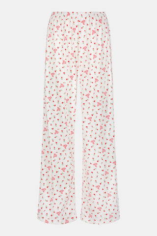 Wearing the Roller Rabbit Mini Monkey Blossom Pointelle Monroe Pant, a person stands barefoot against a plain white background.