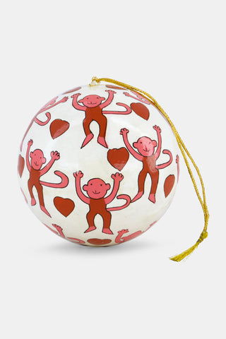 Round Roller Rabbit Monkey Ornament featuring a hand painted pattern of pink and brown monkeys and red hearts, with a gold hanging string.