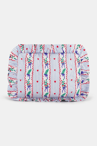 SAPPHIRE Mistletoe Stripe Quilted Ruffle Pouch featuring a blue and white striped pattern decorated with mistletoe sprigs, red hearts, and red wavy lines on a rectangular quilted body with a ruffled edge.