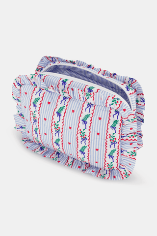 SAPPHIRE Mistletoe Stripe Quilted Ruffle Pouch featuring a blue and white striped pattern decorated with mistletoe sprigs, red hearts, and red wavy lines on a rectangular quilted body with a ruffled edge.