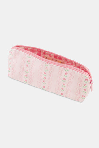 The Daisy Heart Stripe Makeup Bag by Roller Rabbit is a pink cotton canvas cosmetic pouch with a zipper, adorned with a delicate pattern of pink lines and small green and pink floral motifs on a light background.