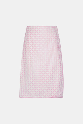 The Roller Rabbit Gingham Hearts Towel Wrap is a knee-length cotton towel wrap in light pink, featuring a pattern of small, evenly spaced pink hearts, and is displayed against a plain white background.