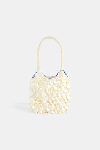 Handbag made of pearls on a white background