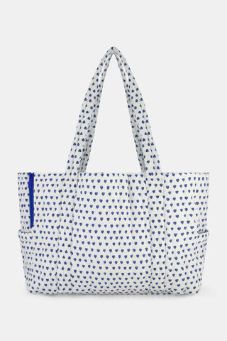 STREETSMART Hearts Dog Carrier tote bag covered in a blue heart pattern with long shoulder straps and a blue side zipper.
