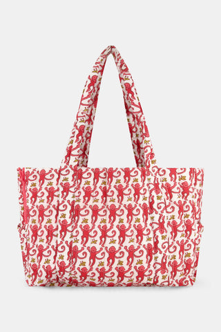 STREETSMART Monkey Dog Carrier, a quilted tote bag featuring a repeating print of red monkeys and yellow bananas on a white background.