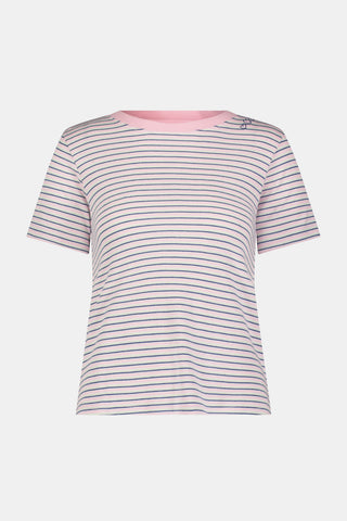 A woman wearing the Roller Rabbit Striped Steph Tee—a short-sleeve, white Pima Cotton pajama top featuring thin horizontal navy and pink stripes and a light pink collar—stands against a plain background.