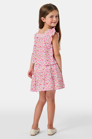 A Roller Rabbit Kids Garden Gate Floral Alexis Skirt with matching briefs, both showcasing a pink, green, and white flower pattern, is displayed on a plain white background. This cotton skirt is ideal for girls who love playful floral prints.