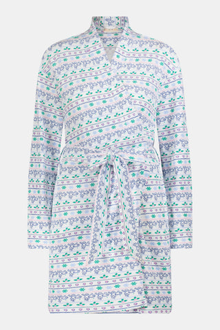A woman wears a knee-length SERFLEX Snowday Stripe Piper Robe featuring horizontal rows of winter-themed snowflakes, hearts, and stars in shades of blue, pink, and green.
