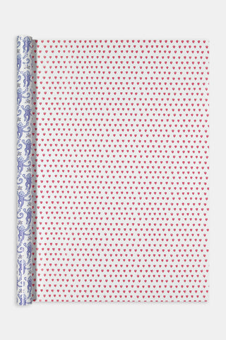 Roller Rabbit Monkey/Hearts Wrapping Paper featuring a double-sided repeating pattern of small pink hearts and a light blue design of monkeys and flowers, perfect for holiday gifting.