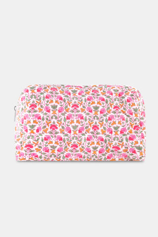 The Roller Rabbit Garden Gate Floral Quilted Makeup Bag is a rectangular, zippered bag crafted from 100 cotton and features a colorful floral print with pink, orange, and green flowers on a white background.
