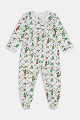 Infant Deck The Halls Foldover Footie in Pima cotton featuring a holiday-themed pattern of monkeys, snowmen, and Christmas trees connected by string lights.