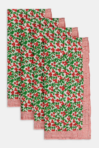 A Holly Berry Napkin Set Of 4 featuring a red berry and green leaf pattern with red-and-white striped borders.