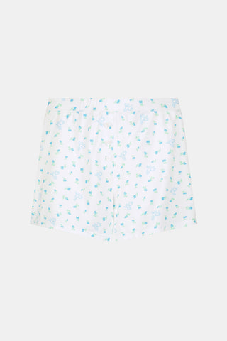 Introducing the Roller Rabbit Mini Monkey Blossom Jones Shortie, a white boxer short featuring a playful pattern of small blue and green turtles and rabbits. Crafted from soft cotton modal for a gentle feel and relaxed fit, this short is showcased against a simple light background.