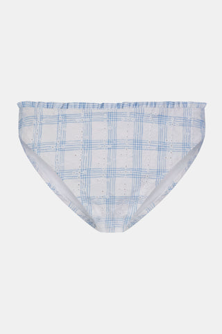 A person wearing the Roller Rabbit Sun Check Eyelet Sydney Bikini Bottom, featuring blue gingham with ruffled edges, is shown from mid-torso to upper thigh against a plain background.