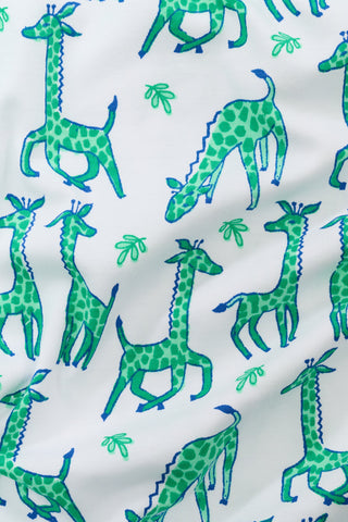 Pattern of green giraffes on a white background