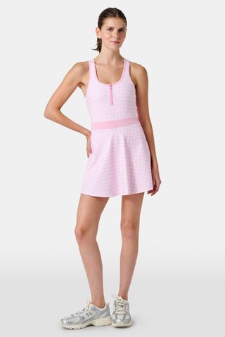 The Roller Rabbit Gingham Hearts Becky Active Dress is a sleeveless pink gingham dress featuring a fitted bodice, zipper front, and flared skirt, crafted from soft peached interlock fabric and shown on a plain white background.