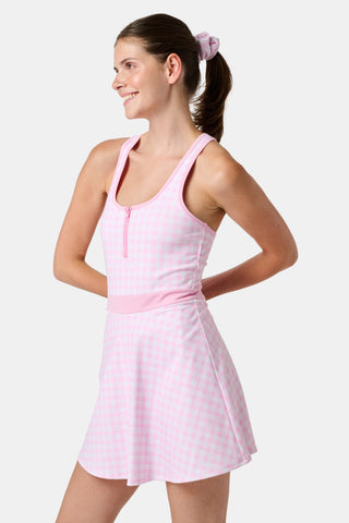 The Roller Rabbit Gingham Hearts Becky Active Dress is a sleeveless pink gingham dress featuring a fitted bodice, zipper front, and flared skirt, crafted from soft peached interlock fabric and shown on a plain white background.