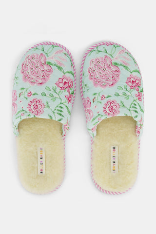 The Camellia Block Quilted Slippers by Roller Rabbit feature a cozy floral pink and green pattern, quilted detailing, a soft fuzzy lining, and pink striped trim around the sole.
