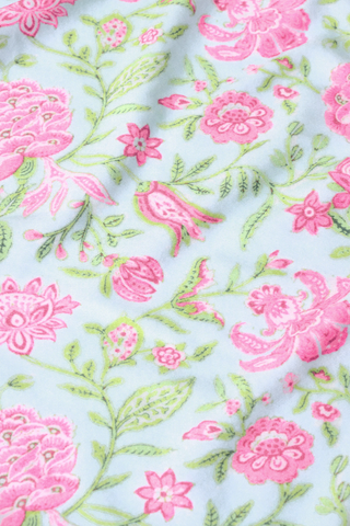 The Camellia Block Millie Set by Roller Rabbit features a light blue Pima cotton fabric with a delicate floral pattern of pink flowers, green leaves, and small pink birds for a nature-inspired look and softly textured finish.