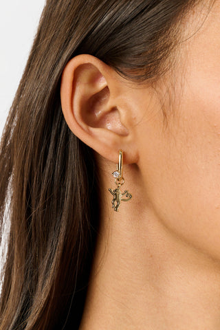 MADISON 501 Monkey Heart Oval Hoops featuring one dangling heart charm and one dangling monkey charm, each set with a small clear stone.
