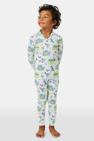 The Roller Rabbit Kids Game, Set, Monkey Parker Polo Pajamas feature a playful print of mice, tents, and trees on a white background. Made from soft pima cotton, this pajama set includes a long-sleeve button-up top and matching pants for children.