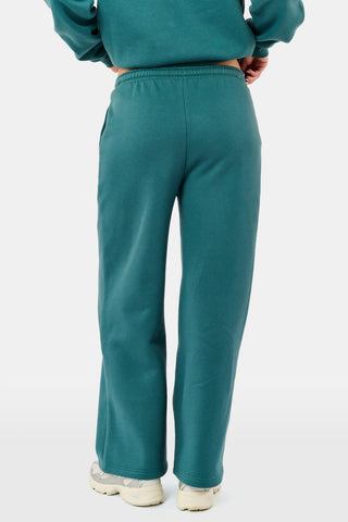 Deep teal wide-leg Sleep Club Mimi Sweatpants in Dream Fleece with an elastic drawstring waist and SLEEP CLUB printed on the right hip.