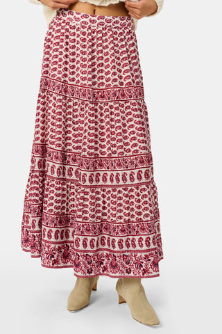 A long, tiered burgundy ornate paisley SAPPHIRE Ornate Paisley Carlisa Skirt worn with tan ankle boots.