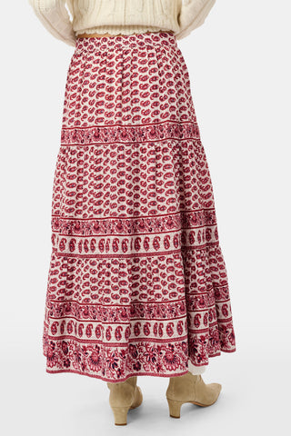A long, tiered burgundy ornate paisley SAPPHIRE Ornate Paisley Carlisa Skirt worn with tan ankle boots.
