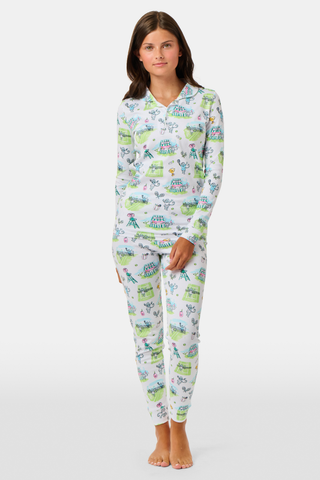 The Roller Rabbit Kids Game, Set, Monkey Parker Polo Pajamas feature a playful print of mice, tents, and trees on a white background. Made from soft pima cotton, this pajama set includes a long-sleeve button-up top and matching pants for children.