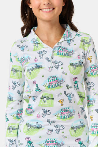 The Roller Rabbit Kids Game, Set, Monkey Parker Polo Pajamas feature a playful print of mice, tents, and trees on a white background. Made from soft pima cotton, this pajama set includes a long-sleeve button-up top and matching pants for children.