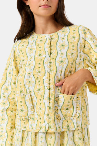 A young girl wearing a Roller Rabbit Kids Lillian Floral Stripe Finn Jacket paired with a matching ruffled skirt and gold ballet flats, standing and smiling against a plain white background—perfect for back-to-school style.