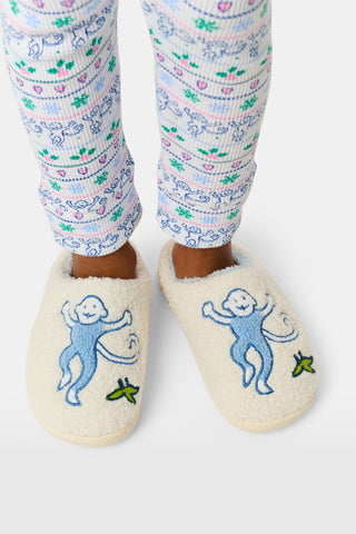 Kids Monkey Fuzzy Slippers in cream, featuring blue embroidered monkeys and small green leaves.