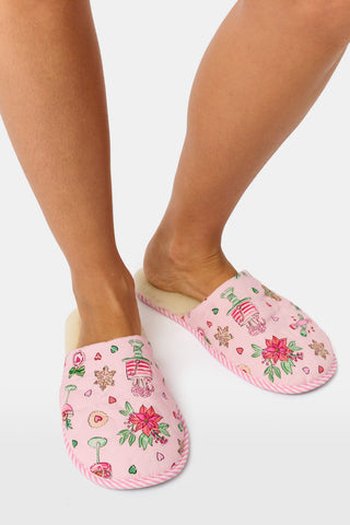 LUHE Seasons Soiree Quilted Slippers in pink, featuring a cream faux fur lining and a pattern of holiday treats, poinsettias, and champagne glasses.