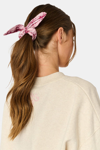 SAPPHIRE Plaid Hearts Bow Scrunchie in red and white with two hanging tails and small heart patterns.